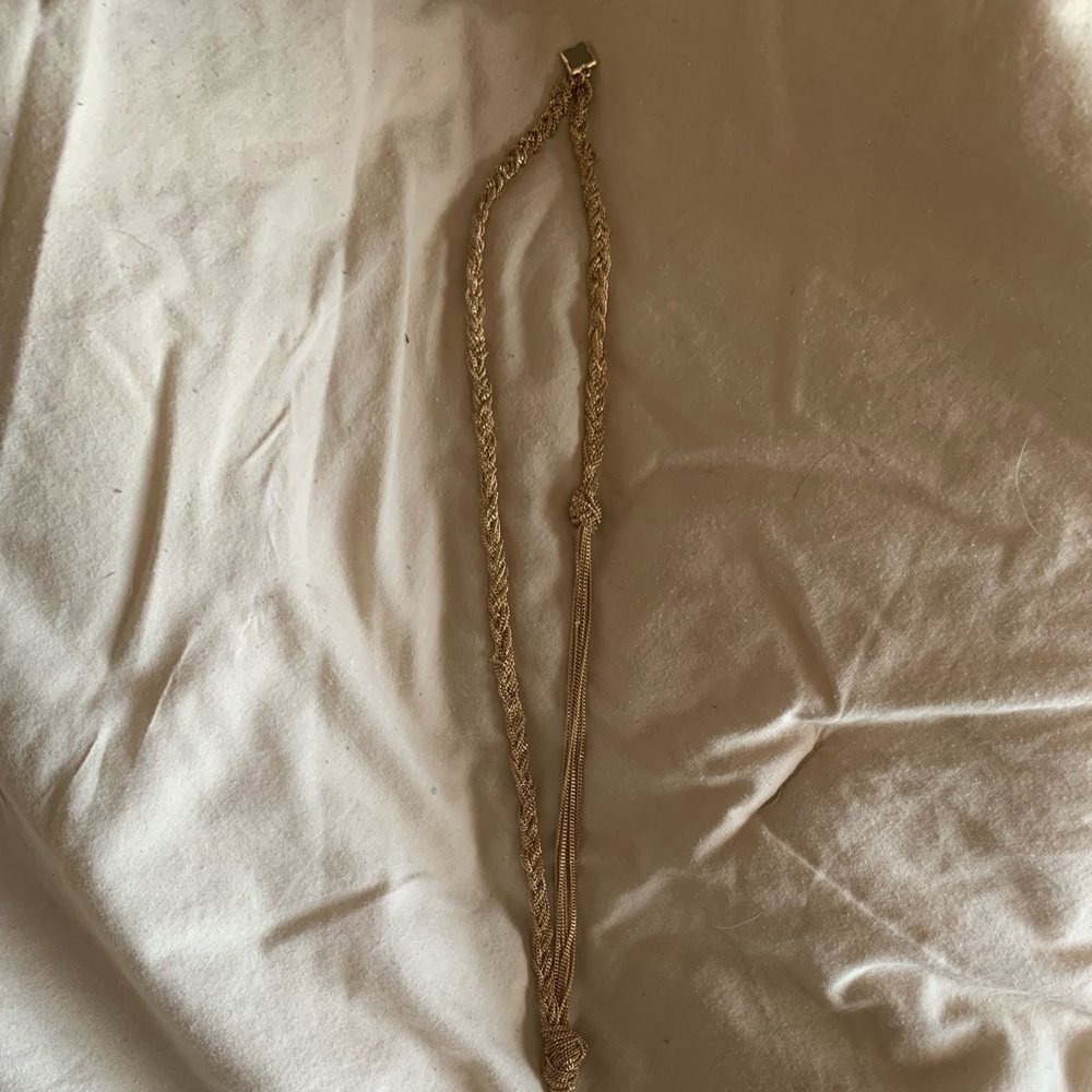 Knotted braided necklace.